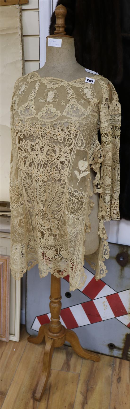 An early 1920s handmade bobbin and needle lace tunic worked with needle lace insertions and Brussels trim